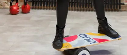 A man balancing on a board.