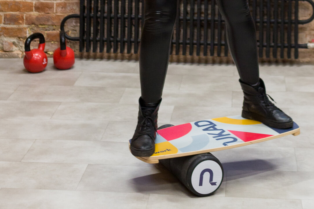 A man balancing on a board.